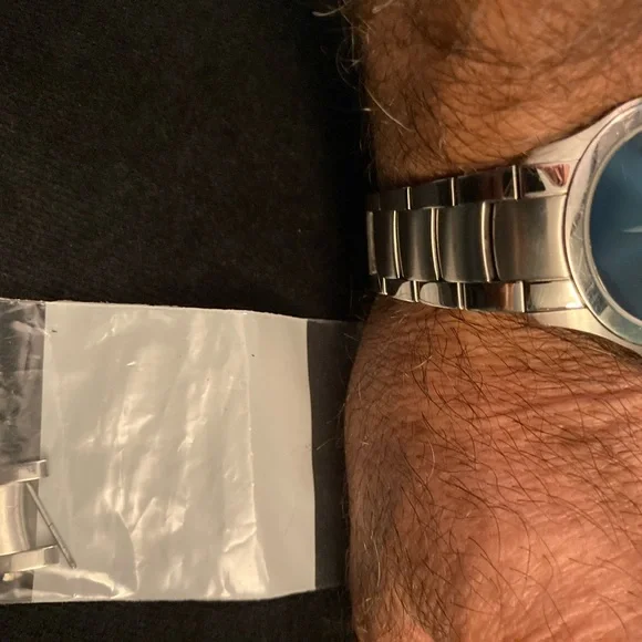 Movado men masino blue, light ware on bezel crystal is in great shape watch